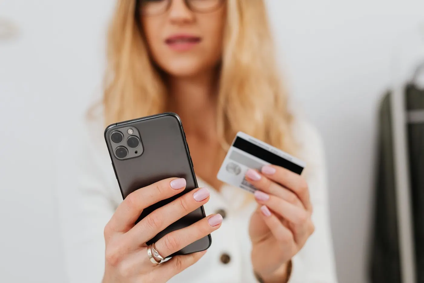 A customer paying by card at checkout